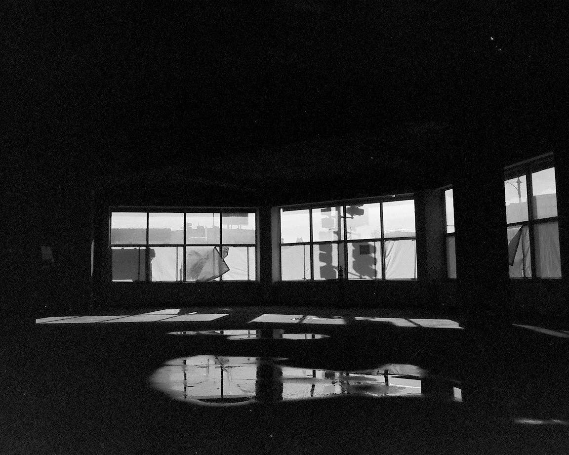 A black-and-white photo of the view through many windows.